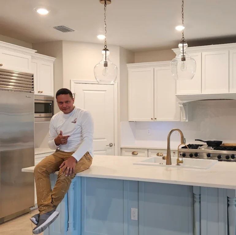 Professional painter from Alejo Painting INC working on a residential property in Sarasota Florida